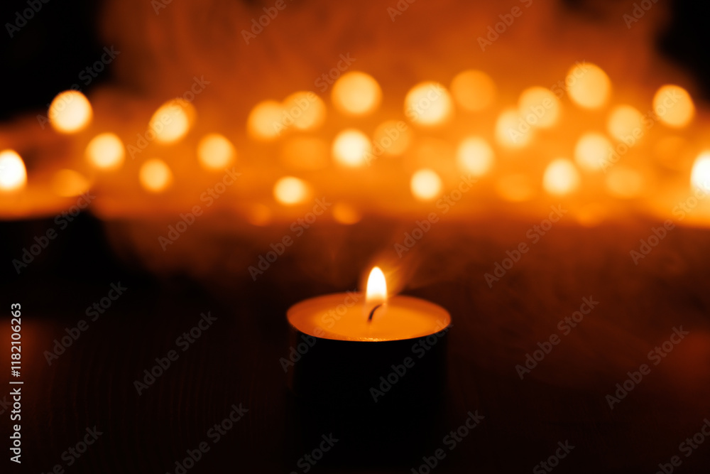 Holy glowing candlelight with soft background candles on black Holy glowing candlelight with soft background candles on black