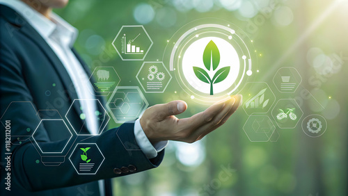 Businessman Holding Digital Plant Icon in Nature Background