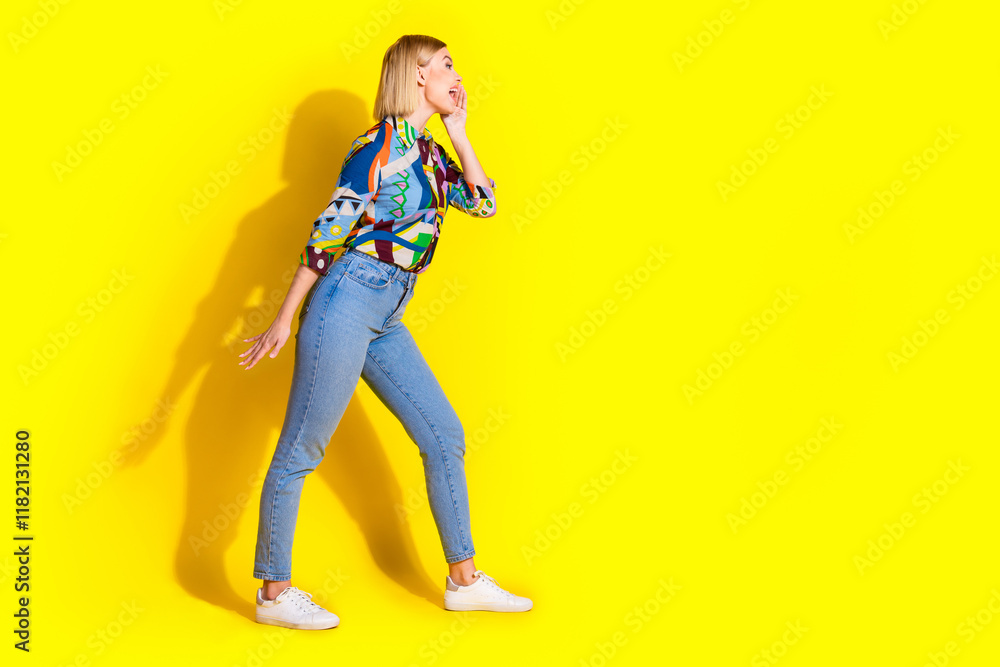 Full size photo of pretty young girl scream empty space wear trendy colorful outfit isolated on yellow color background Full size photo of pretty young girl scream empty space wear trendy colorful outfit isolated on yellow color background