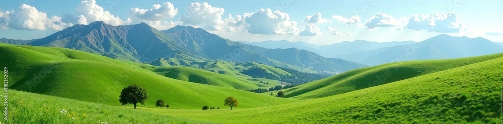 Obraz premium Rolling hills with silty mountains in the background and fluffy white clouds, silty mountains, serene, nature