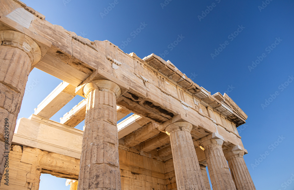 Visit Acropolis hill and the temple of Parthenon. Beautiful view during a sunny day with this heritage landmark of Greek history from Athens. Travel to Greece.