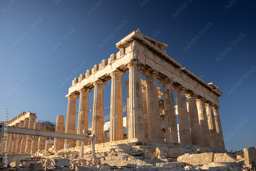 Visit Acropolis hill and the temple of Parthenon. Beautiful view during a sunny day with this heritage landmark of Greek history from Athens. Travel to Greece.