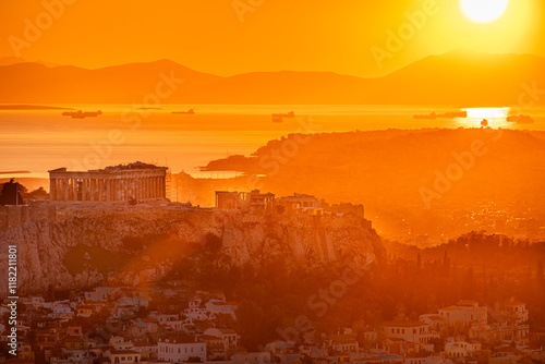 Obraz na płótnie Sunset over Arcopolis hill in Athens. Beautiful orange sky landscape, view from above from Lycabetus Hill, to the Anciend World of Parthenon. Travel to Athens, Greece. w salonie