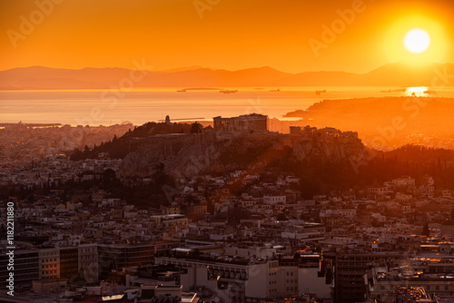 Obraz na płótnie Sunset over Arcopolis hill in Athens. Beautiful orange sky landscape, view from above from Lycabetus Hill, to the Anciend World of Parthenon. Travel to Athens, Greece. w salonie