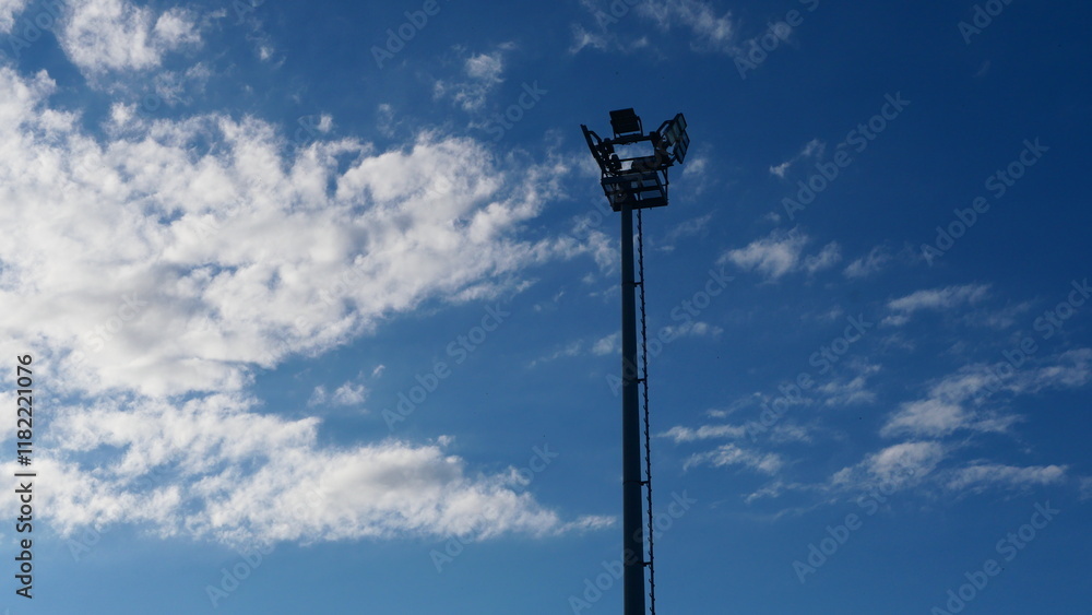 Lampposts against the blue sky, bottom view, street lighting, city improvement Lampposts against the blue sky, bottom view, street lighting, city improvement