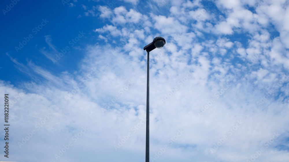 Lampposts against the blue sky, bottom view, street lighting, city improvement Lampposts against the blue sky, bottom view, street lighting, city improvement