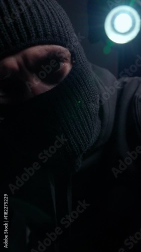 Close-Up of Masked Man with Light in Background