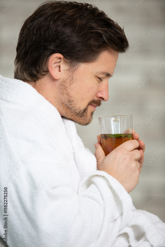 morning portrait of handsome young man with cup of tea morning portrait of handsome young man with cup of tea