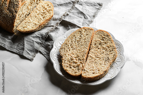 freshly baked round bread with sesame seeds photo