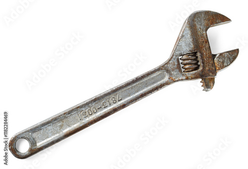 Old rusty adjustable wrench. Variable-size wrench used to rotate nuts, bolts, and other parts,  ideal for plumbing, mechanical repairs.