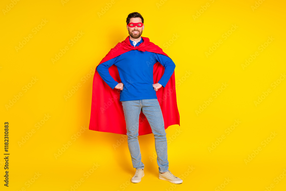 Full body photo of attractive young man confident superhero pose dressed stylish blue clothes isolated on yellow color background Full body photo of attractive young man confident superhero pose dressed stylish blue clothes isolated on yellow color background