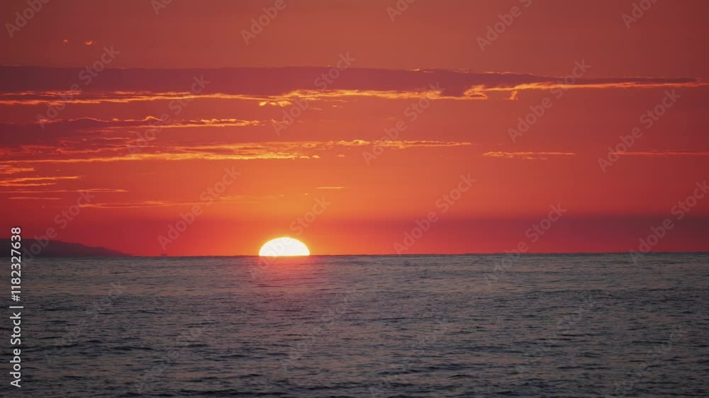 A captivating ocean sunset featuring a vivid red and orange sky in the background, barcelona sea sunset view, spain. A captivating ocean sunset featuring a vivid red and orange sky in the background, barcelona sea sunset view, spain.