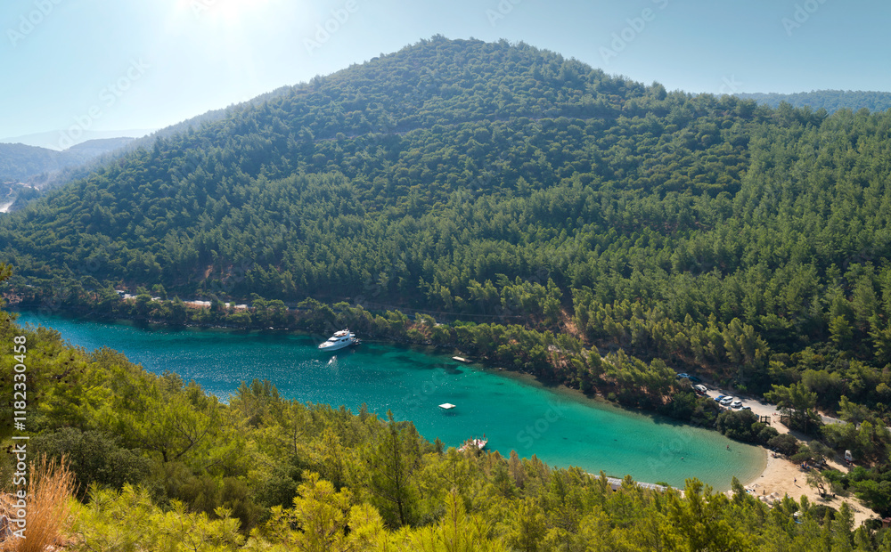 Obraz premium Amazing hilltop view of Paradise bay. A quiet turquoise tourist beach on the Bodrum peninsula. Aegean coast. Turkey holidays and travel. Mugla city, Turkey