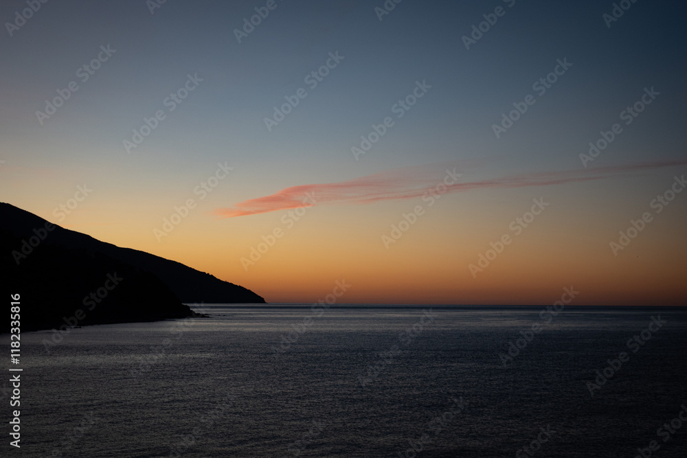 A stunning sunset over a calm Mediterranean sea. Mount Athos. Greece. A stunning sunset over a calm Mediterranean sea. Mount Athos. Greece.