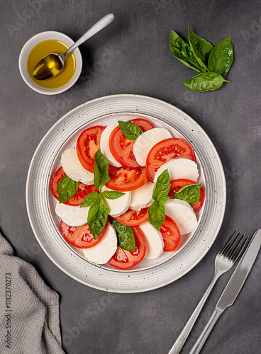 Food photography of salad caprese with mozzarella cheese, tomatoes, basil, olive oil, italian cuisine, healthy natural dish