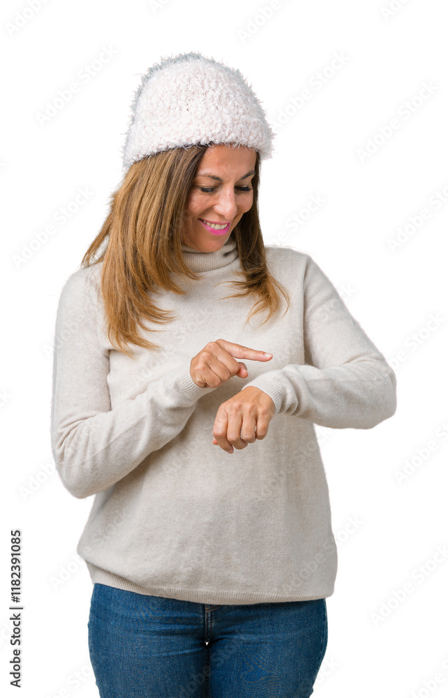 Beautiful middle age woman wearing winter sweater and hat over isolated background Checking the time on wrist watch, relaxed and confident Beautiful middle age woman wearing winter sweater and hat over isolated background Checking the time on wrist watch, relaxed and confident
