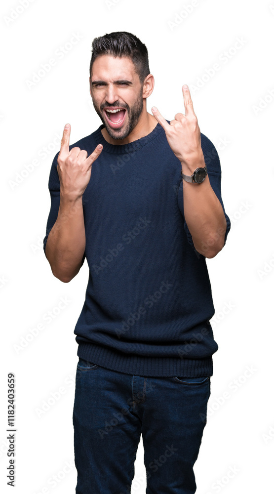 Fototapeta premium Young handsome man wearing sweater over isolated background shouting with crazy expression doing rock symbol with hands up. Music star. Heavy concept.