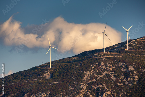 Obraz na płótnie Wind turbines on the hills of Greece. Industrial concept photo for wind mills that produce electricity from wind power. Wind turbines on Parnassus mountain hills in Greece. Green energy. w salonie