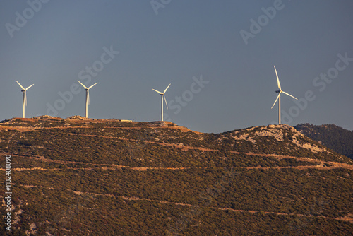 Obraz na płótnie Wind turbines on the hills of Greece. Industrial concept photo for wind mills that produce electricity from wind power. Wind turbines on Parnassus mountain hills in Greece. Green energy. w salonie