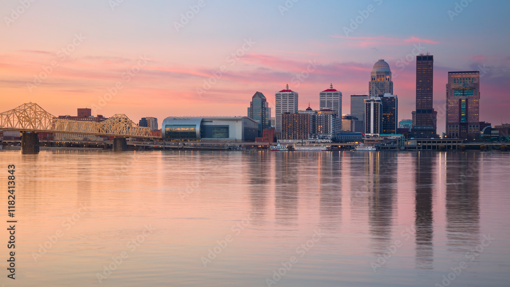 Louisville, Kentucky, USA. Cityscape image of Louisville, Kentucky, USA downtown skyline with reflection of the city the Ohio River at spring sunrise.
