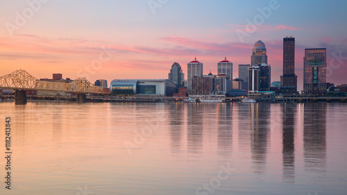 Obraz na płótnie Louisville, Kentucky, USA. Cityscape image of Louisville, Kentucky, USA downtown skyline with reflection of the city the Ohio River at spring sunrise. w salonie