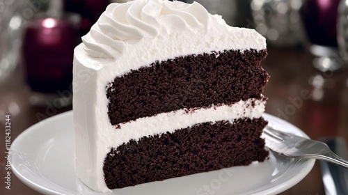 Delicious Chocolate Cake Slice with White Frosting photo