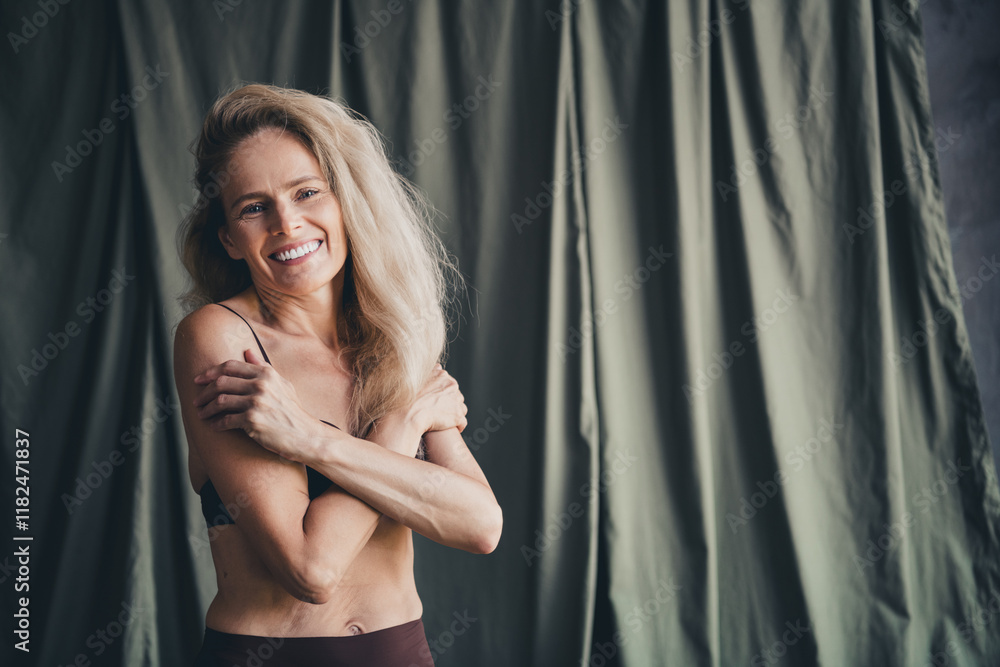 Fototapeta premium No filter studio photo of sweet pretty woman wear lingerie embracing loving herself isolated khaki textile background