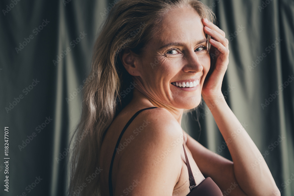 Studio no retouch photo of positive good mood lady dressed lingerie accepting her age isolated khaki textile background Studio no retouch photo of positive good mood lady dressed lingerie accepting her age isolated khaki textile background