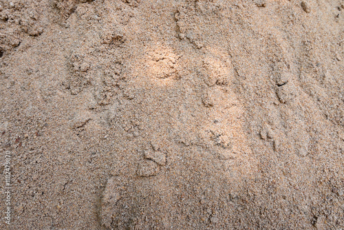 View of a portion of a pile of river sand that is stacked as a large pile