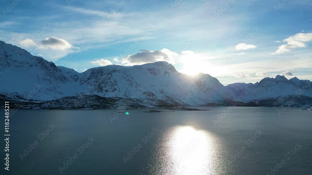 Aerial view of sunrise over mountains and fjord in Sjursnes, winter time Aerial view of sunrise over mountains and fjord in Sjursnes, winter time