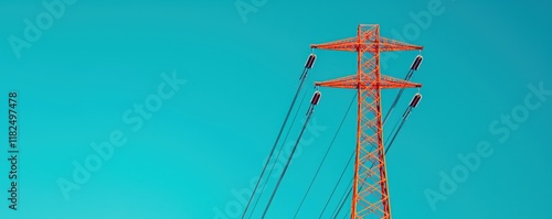 Vibrant Orange Electricity Tower Against Blue Sky photo