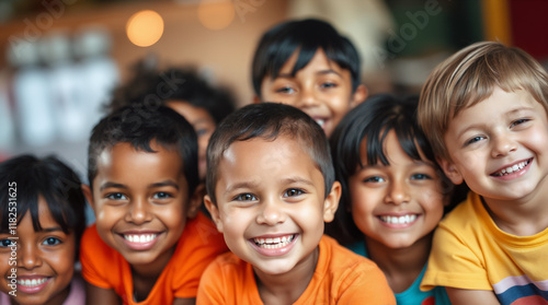 Diverse group of elementary school children smiling together, displaying joy, friendship and unity in educational environment with colorful clothing