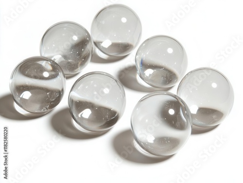 crystal clear water bubbles rising against pure white background with perfect spherical shapes and natural light refraction
