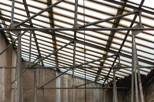 glass roof in an old house, glass attic with iron supports