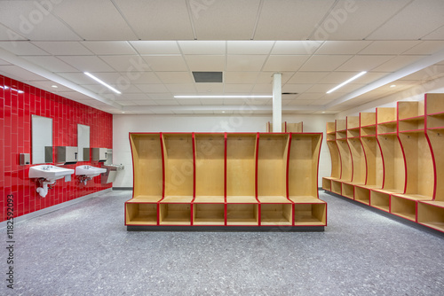 Slika na platnu Empty team locker, changing room with traditional open wooden lockers with a red trim