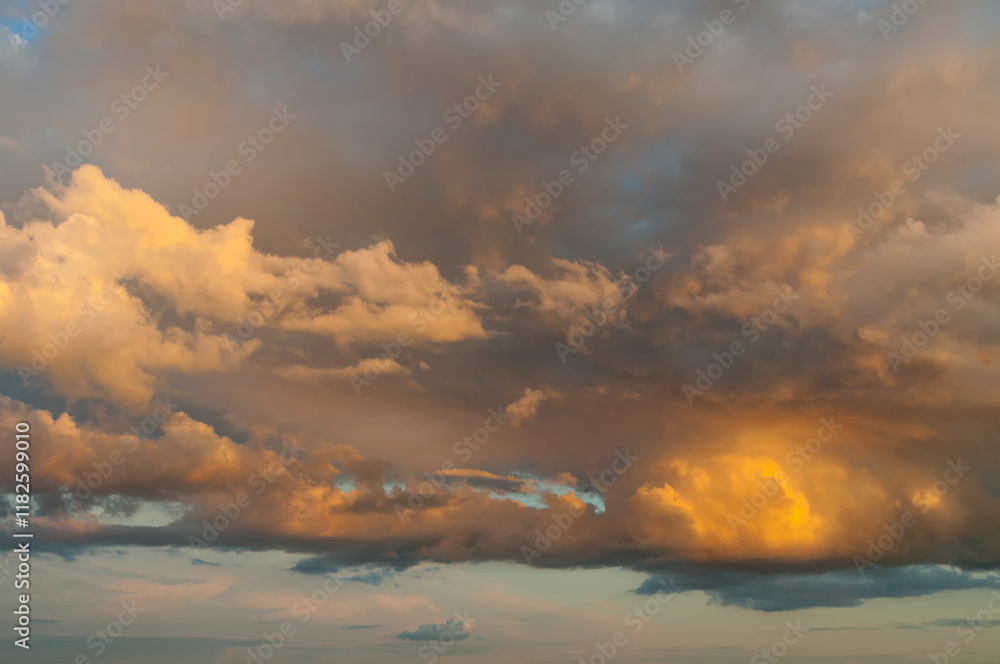 Stunning sunset sky background, vivid scenic sunset sky, picturesque clouds high in the evening sky, sunset sky landscape scene in fantastic colors
