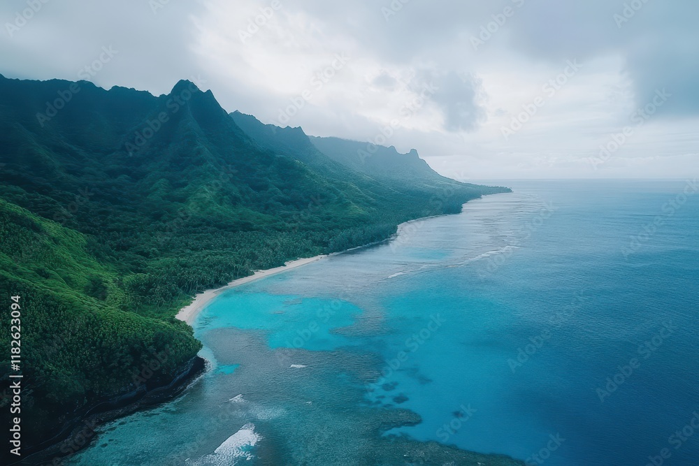 Obraz premium Lush green cliffs meet serene turquoise waters along a remote coastline under a cloudy sky at dawn