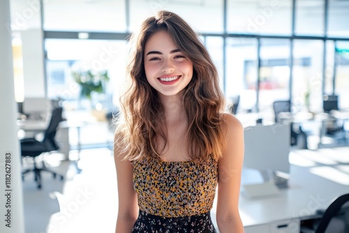 A young professional sitting at a desk with a smile Free Download A young professional sitting at a desk with a smile - GFXLoad