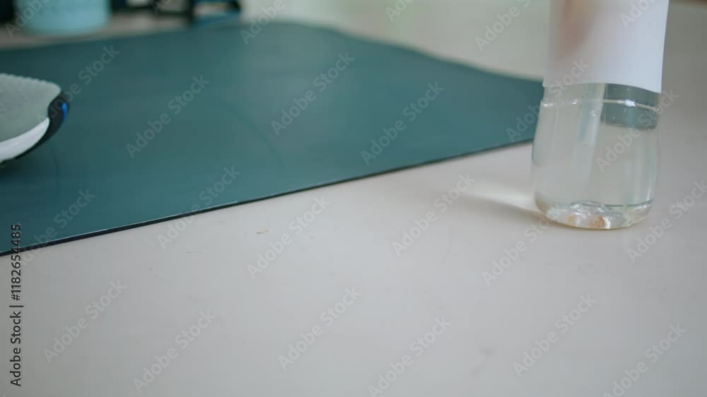 Woman hands taking dumbbells on floor at daily workout closeup. Lady fitness Woman hands taking dumbbells on floor at daily workout closeup. Lady fitness