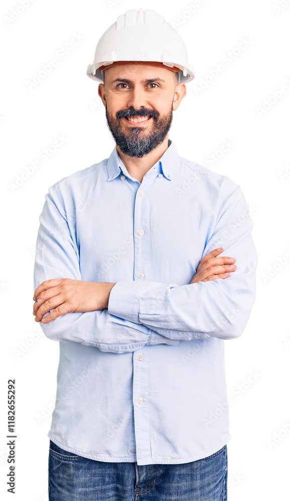 Young handsome man wearing architect hardhat happy face smiling with crossed arms looking at the camera. positive person. Young handsome man wearing architect hardhat happy face smiling with crossed arms looking at the camera. positive person.