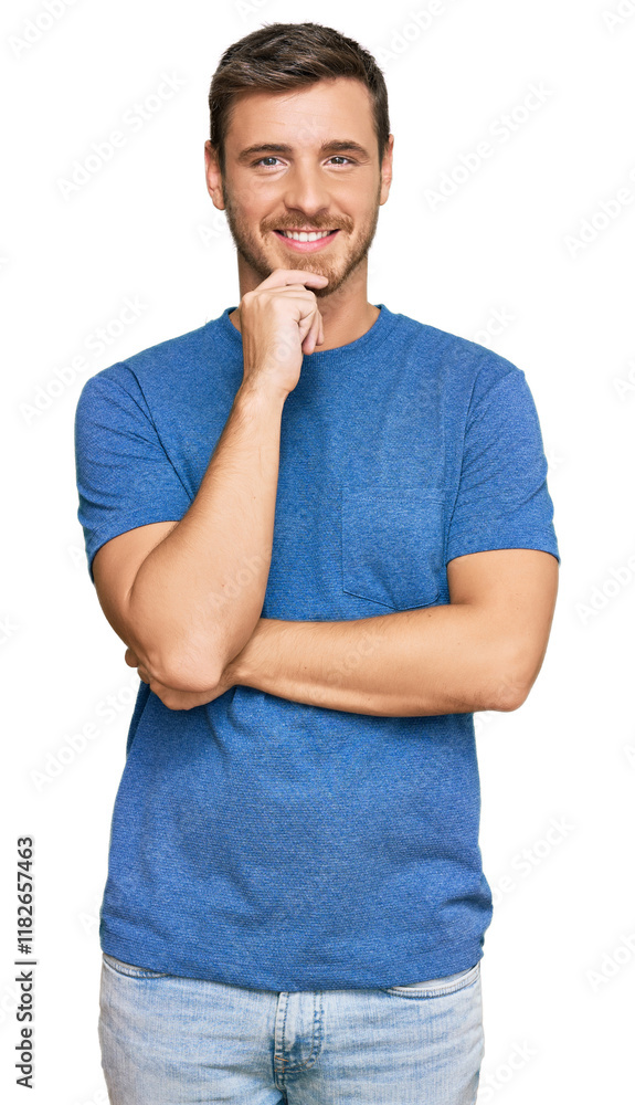 Handsome caucasian man wearing casual clothes looking confident at the camera with smile with crossed arms and hand raised on chin. thinking positive. Handsome caucasian man wearing casual clothes looking confident at the camera with smile with crossed arms and hand raised on chin. thinking positive.
