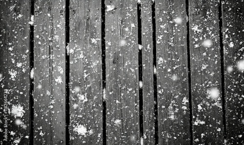 Fresh Snowfall on Wooden Planks - A Silent Overture to the Season's Quiet Symphony