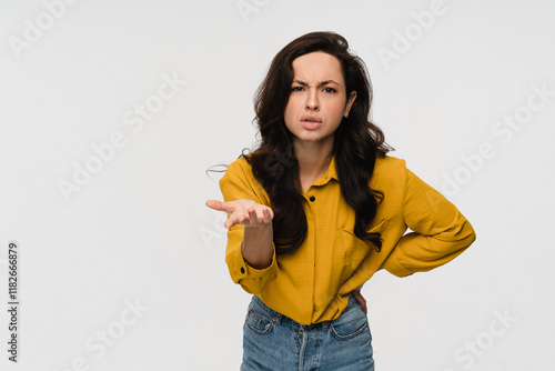 Photo of questioned clueless young woman girl lady student eyebrow up boss puzzled don't know solution problem hold palm no idea isolated on white color background copy space photo