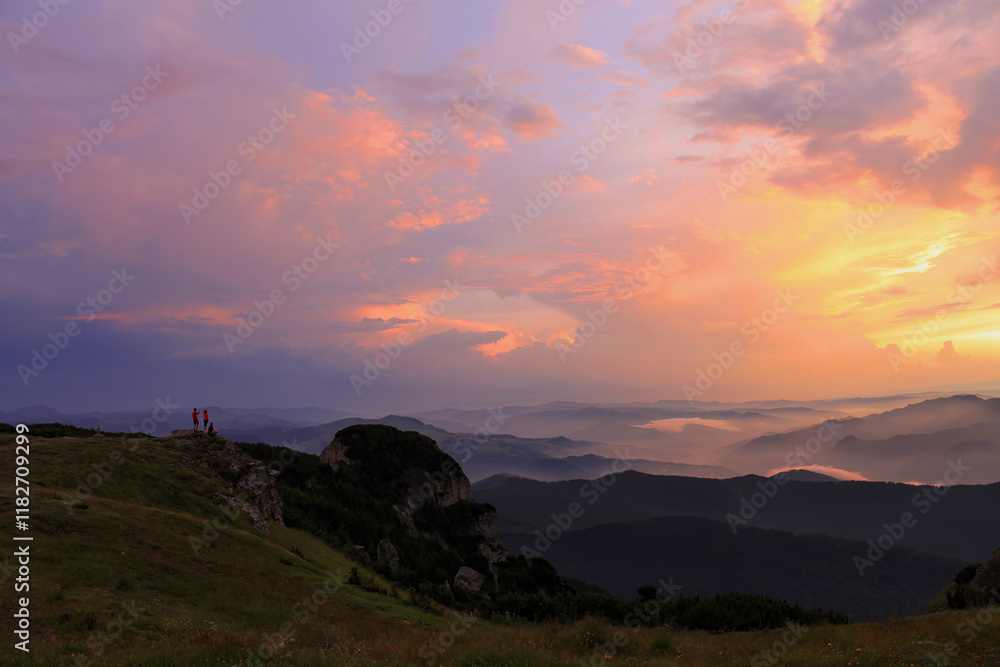 A beautiful sunset over a mountain range A beautiful sunset over a mountain range