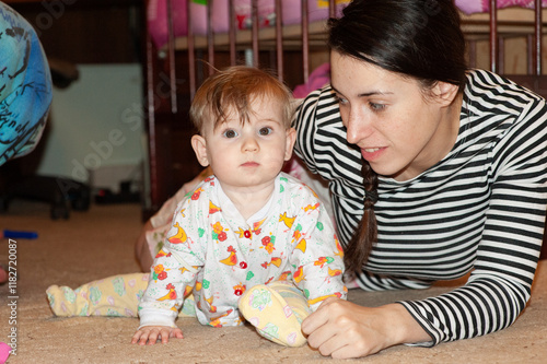 home family photo, six month old girl sits on the floor with her mother, archive photos, retro photos photo