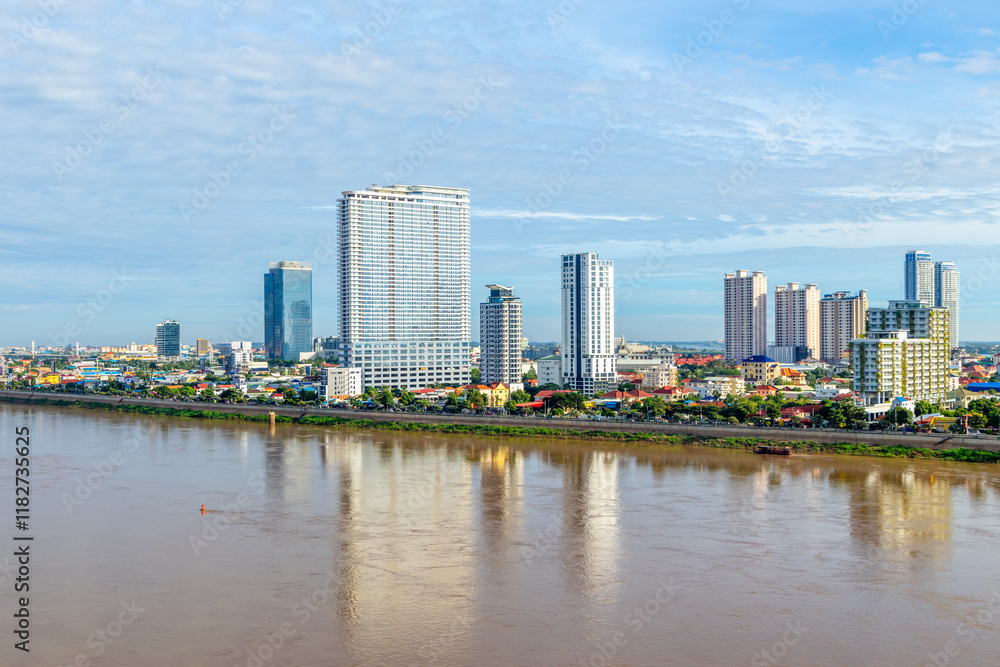 Tonle Sap river bank with modern buildings and residential areas distric in the background, Phnom Penh city panorama, Cambodia Tonle Sap river bank with modern buildings and residential areas distric in the background, Phnom Penh city panorama, Cambodia