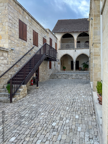 The old town of Omodos in Cyprus with historic buildings, narrow streets with shops focused on selling regional souvenirs, arts and crafts photo