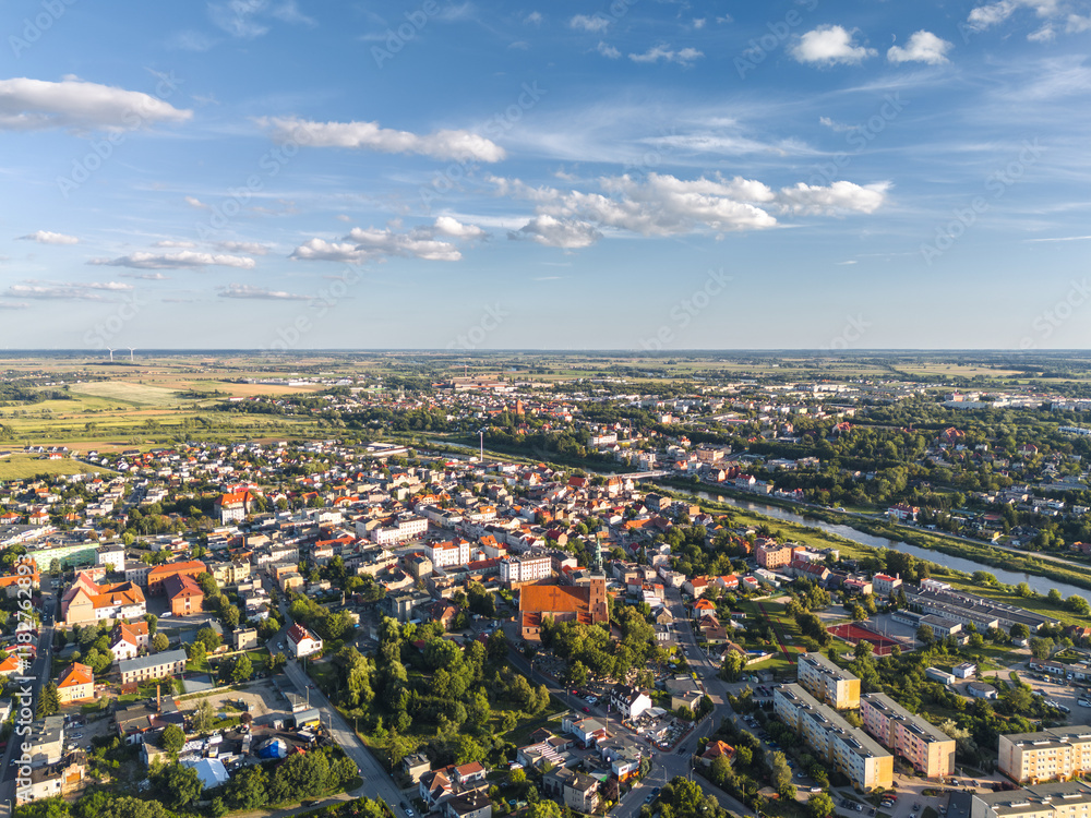 Summer skyline cityscape of Śrem, Wielkopolska, Poland at sunset. Wide aerial landscape view