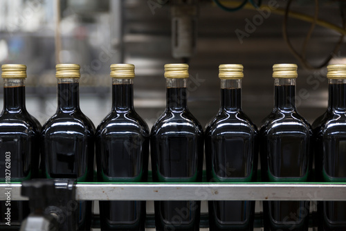 Vinegar bottles in a bottling line during the production process