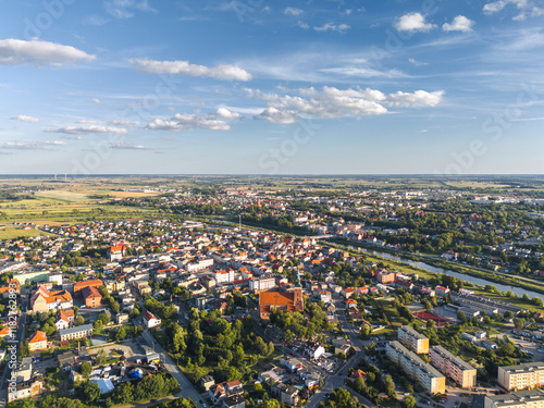 Obraz na płótnie Summer skyline cityscape of Śrem, Wielkopolska, Poland at sunset. Wide aerial landscape view w salonie